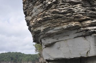 Climbing the cliffs above clear Summersville Lake