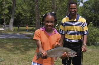 Anglers with a rainbow trout caught in West Virginia